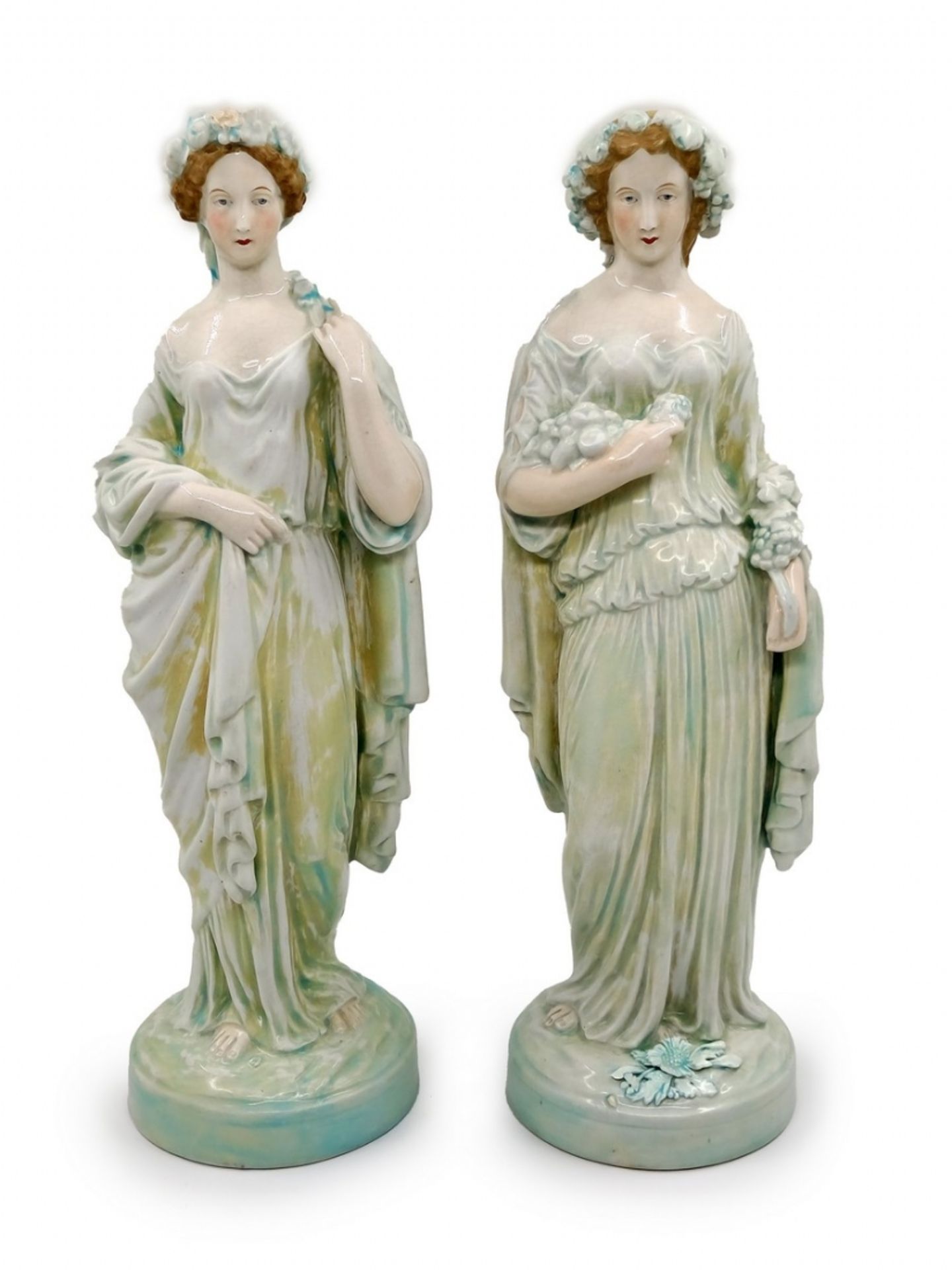 A pair of beautiful antique porcelain statues, an allegory for autumn and spring, decorated with