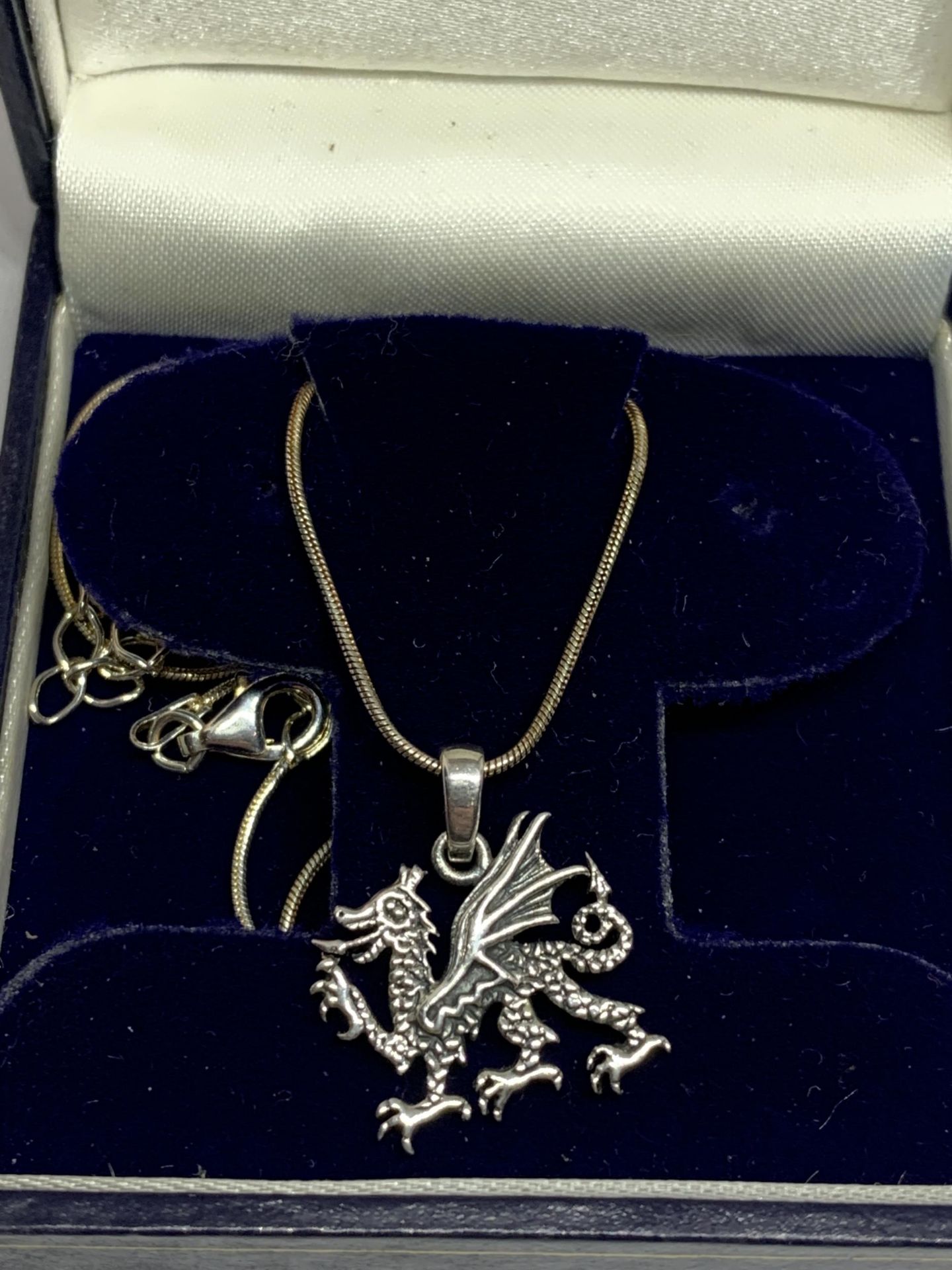 A WELSH DRAGON NECKLACE IN A PRESENTATION BOX