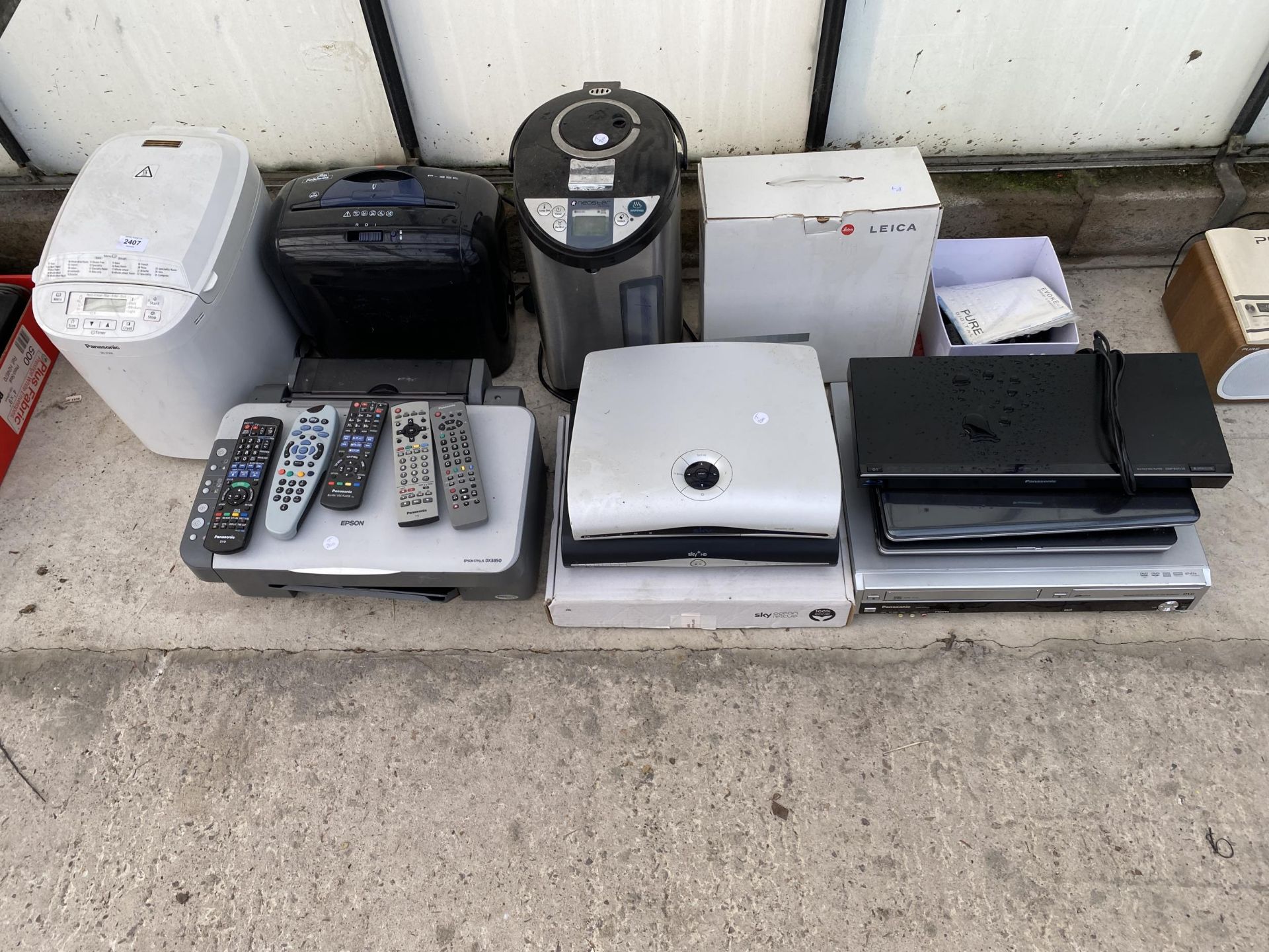 A LARGE ASSORTMENT OF ITEMS TO INCLUDE DVD PLAYERS, AN EPSON PRINTER AND A PANASONIC BREAD MAKER ETC