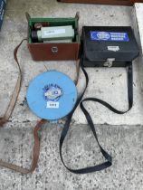 A VINTAGE VICKERS SURVEYORS LEVEL, A SOVEREIGN MOISTURE MASTER AND A TAPE MEASURE ETC