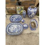 AN ASSORTMENT OF BLUE AND WHITE CERAMICS TO INCLUDE MEAT PLATTERS, VASES AND A PLANTER ETC