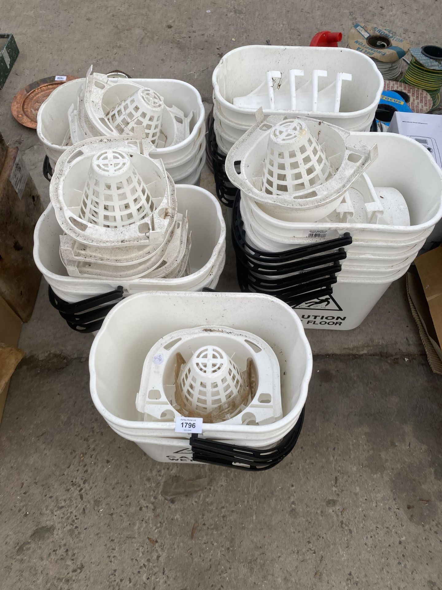 A LARGE QUANTITY OF NEW PLASTIC MOP BUCKETS WITH WARNING
