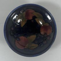 A 1930S MOORCROFT ART DECO POMEGRANATE MINIATURE FOOTED BOWL, 3" DIAMETER