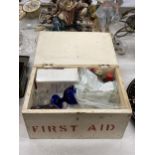A VINTAGE FIRST AID BOX WITH CONTENTS TO INCLUDE GLASS BOTTLES, ETC