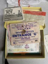 A BOX OF RUGBY MATCH TICKETS