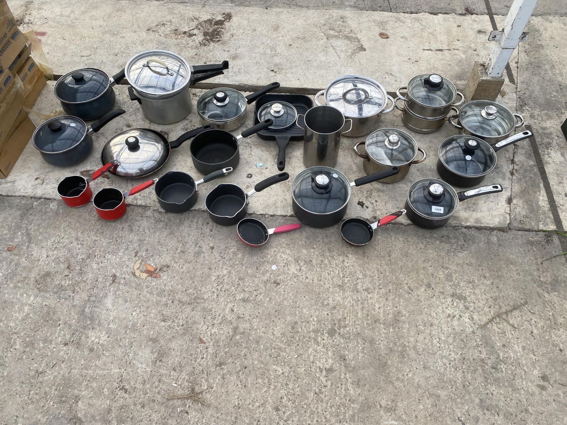 A LAGE QUANTITY OF KITCHEN POTS AND PANS ETC