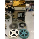 A BOXED KODAK BROWNIE 8 MM FILM PROJECTOR AND REELS