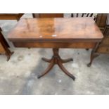 A 19TH CENTURY STYLE MAHOGANY FOLD-OVER GAMES TABLE, 33.5" WIDE