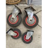 TWO PAIRS OF TROLLEY WHEELS