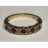 AN 18 CARAT GOLD RING WITH FOUR DIAMONDS AND FIVE RUBY IN LINE SIZE K