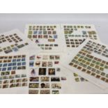 TEN PLUS SHEETS CONTAINING STAMPS FROM UGANDA