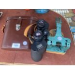 A VINTAGE PAIR OF BINOCULARS WITH CARRY CASE AND A VINTAGE STAMP