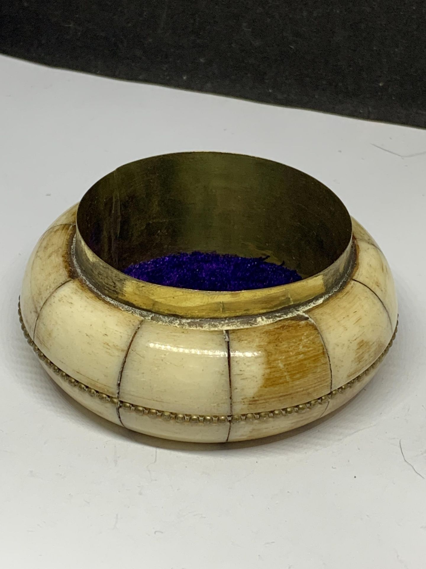 A BRASS AND BONE BOWL