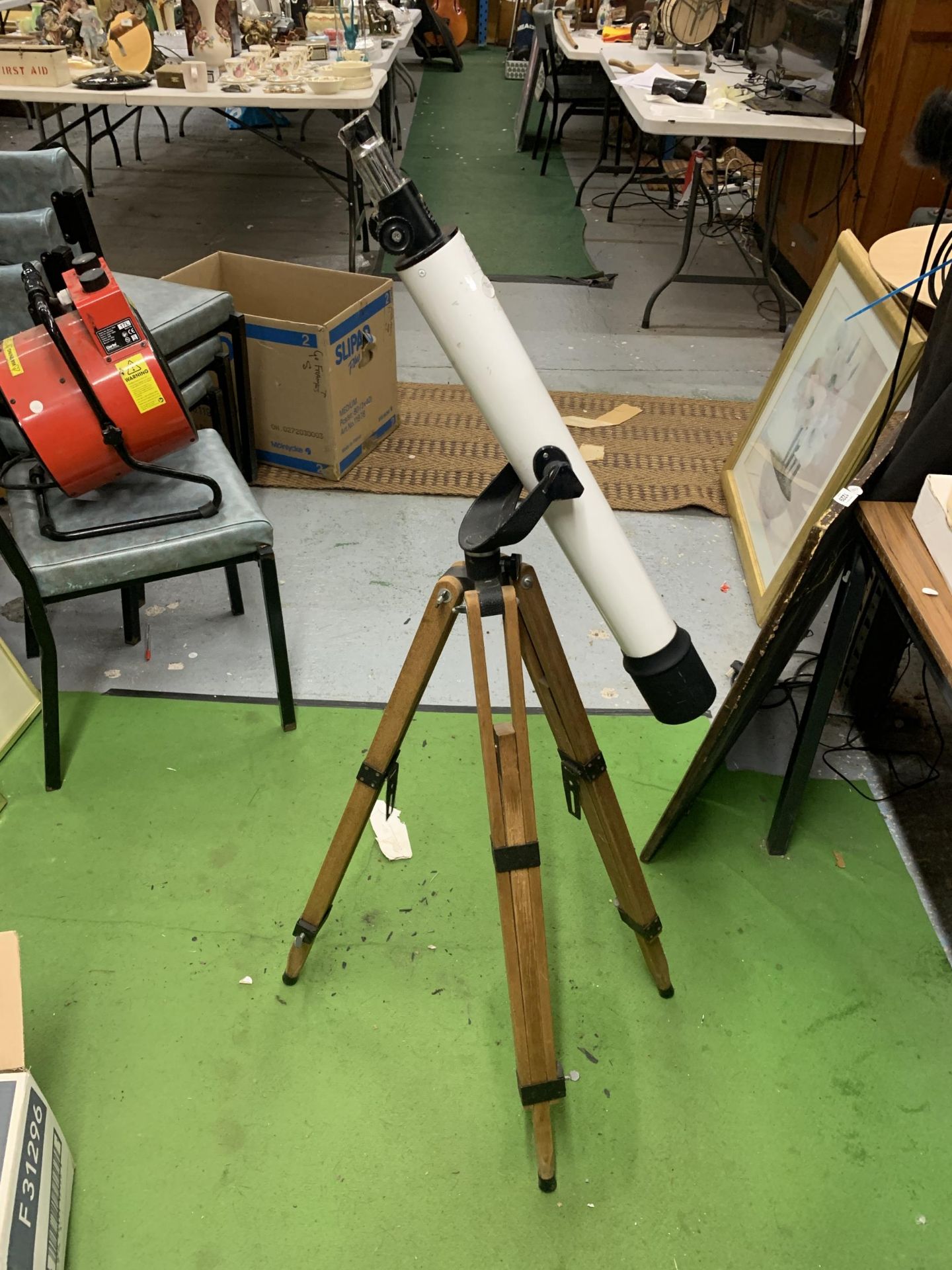 A STUDENTS TELESCOPE ON WOODEN TRIPOD BASE