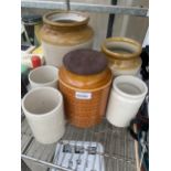 AN ASSORTMENT OF STONEWARE VESSELS TO INCLUDE TWO BROWN AND CREAM GLAZED POTS AND A HORNSEA FLOUR