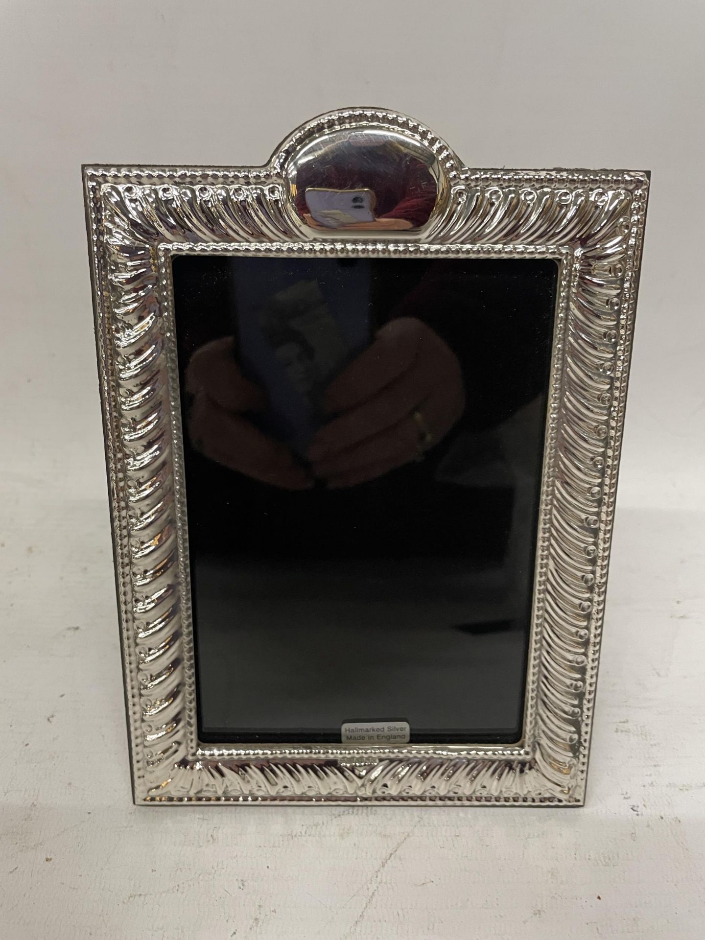 A HALLMARKED SILVER PHOTOGRAPH FRAME