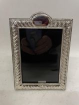 A HALLMARKED SILVER PHOTOGRAPH FRAME