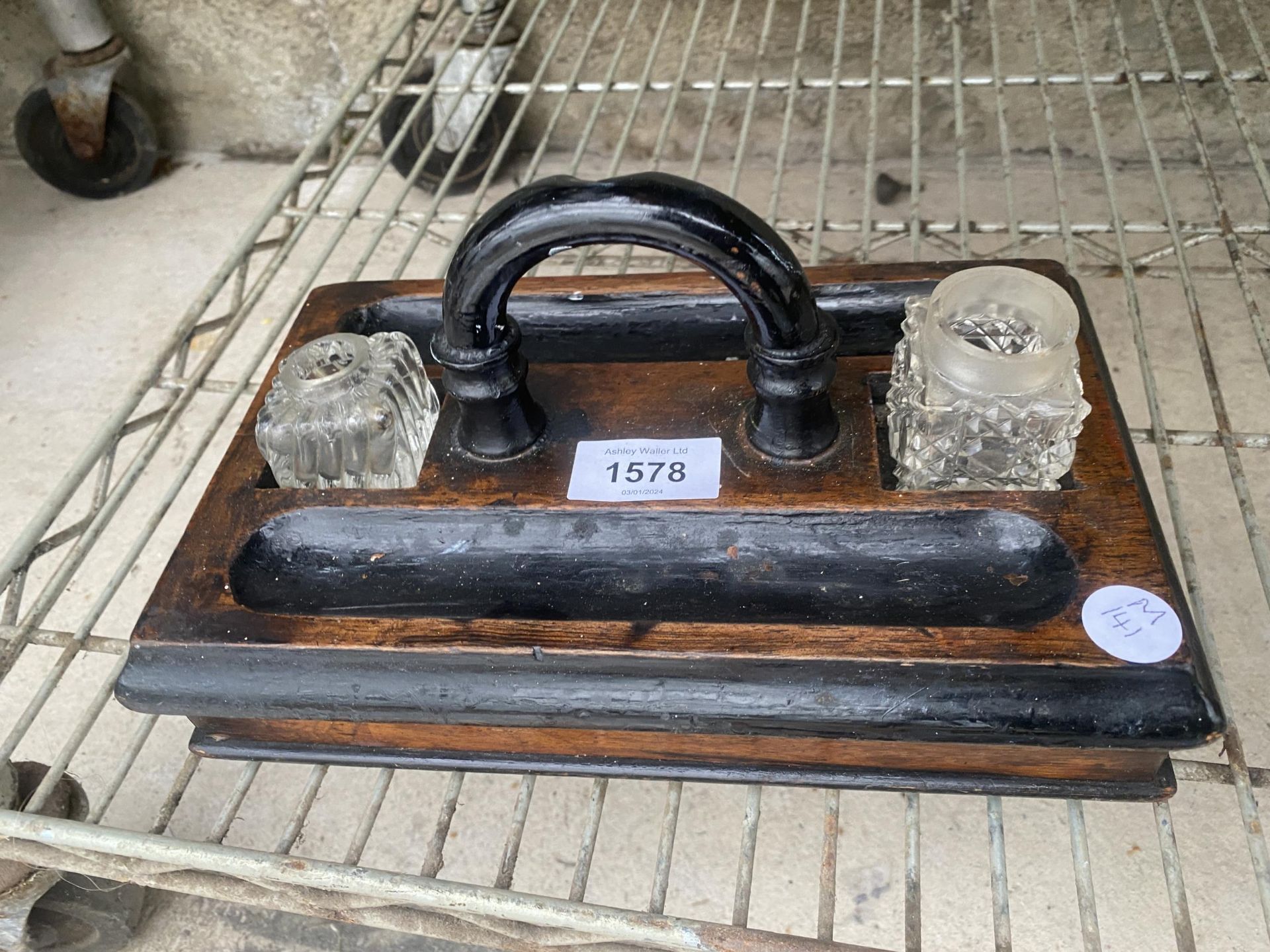 A VINTAGE WOODEN INK WELL STAND COMPLETE WITH GLASS POTS