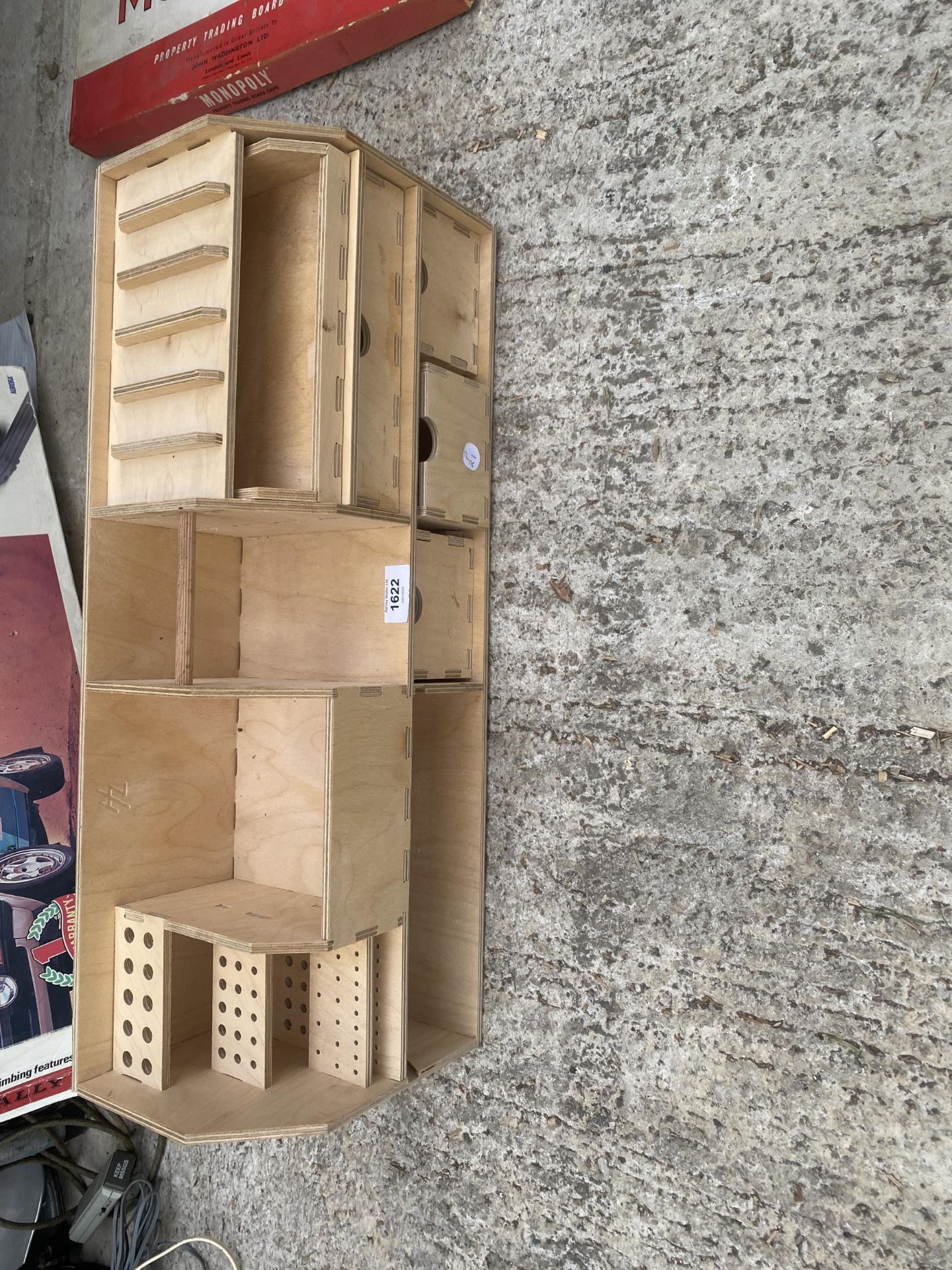 A WOODEN DESK TIDY STORAGE UNIT