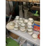 A LARGE COLLECTION OF BONE CHINA CUPS AND SAUCERS, CUT GLASS VASES ETC