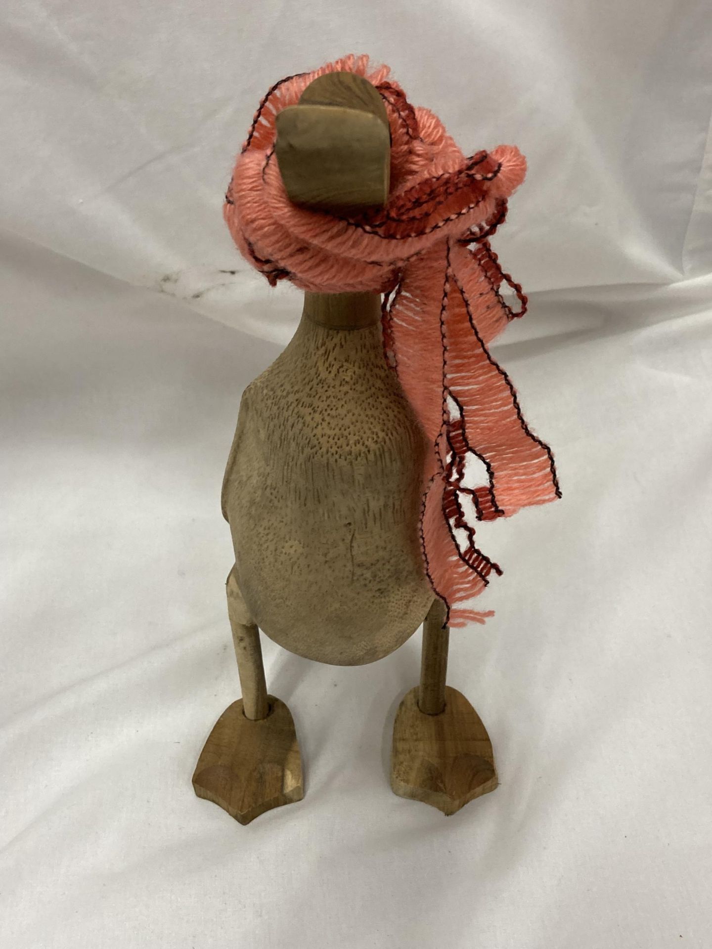 A WOODEN DUCK WITH SHAWL