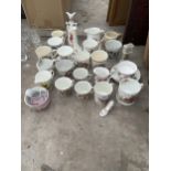 AN ASSORTMENT OF CERAMIC ITEMS TO INCLUDE CUPS AND BUD VASES ETC