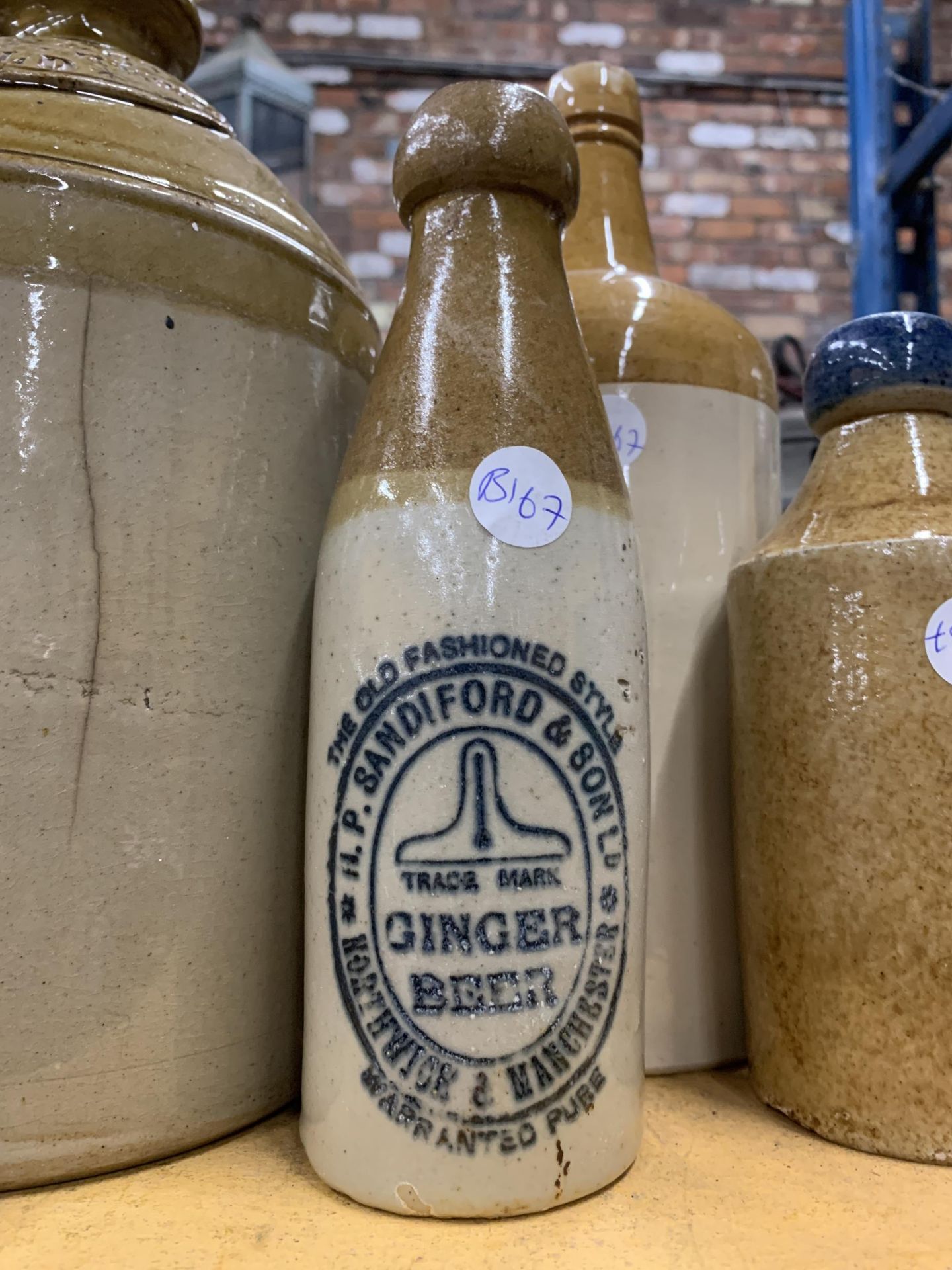 A COLLECTION OF VINTAGE STONEWARE BOTTLES / FLAGONS, INCLUDING LOCAL INTEREST MANCHESTER AND CREWE - Image 4 of 5