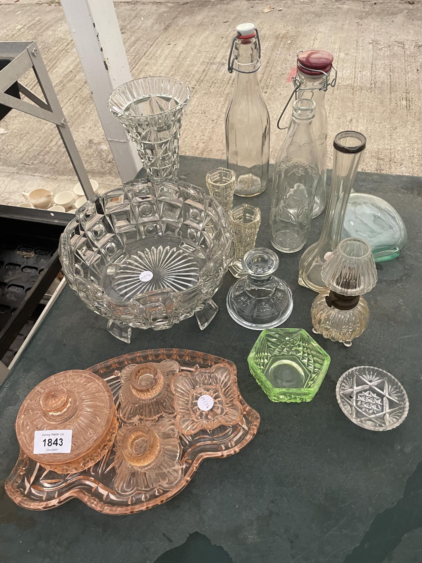 AN ASSORTMENT OF GLASS WARE ITEMS TO INCLUDE A DRESSING TABLE SET, KILNER BOTTLES AND CANDLESTICKS