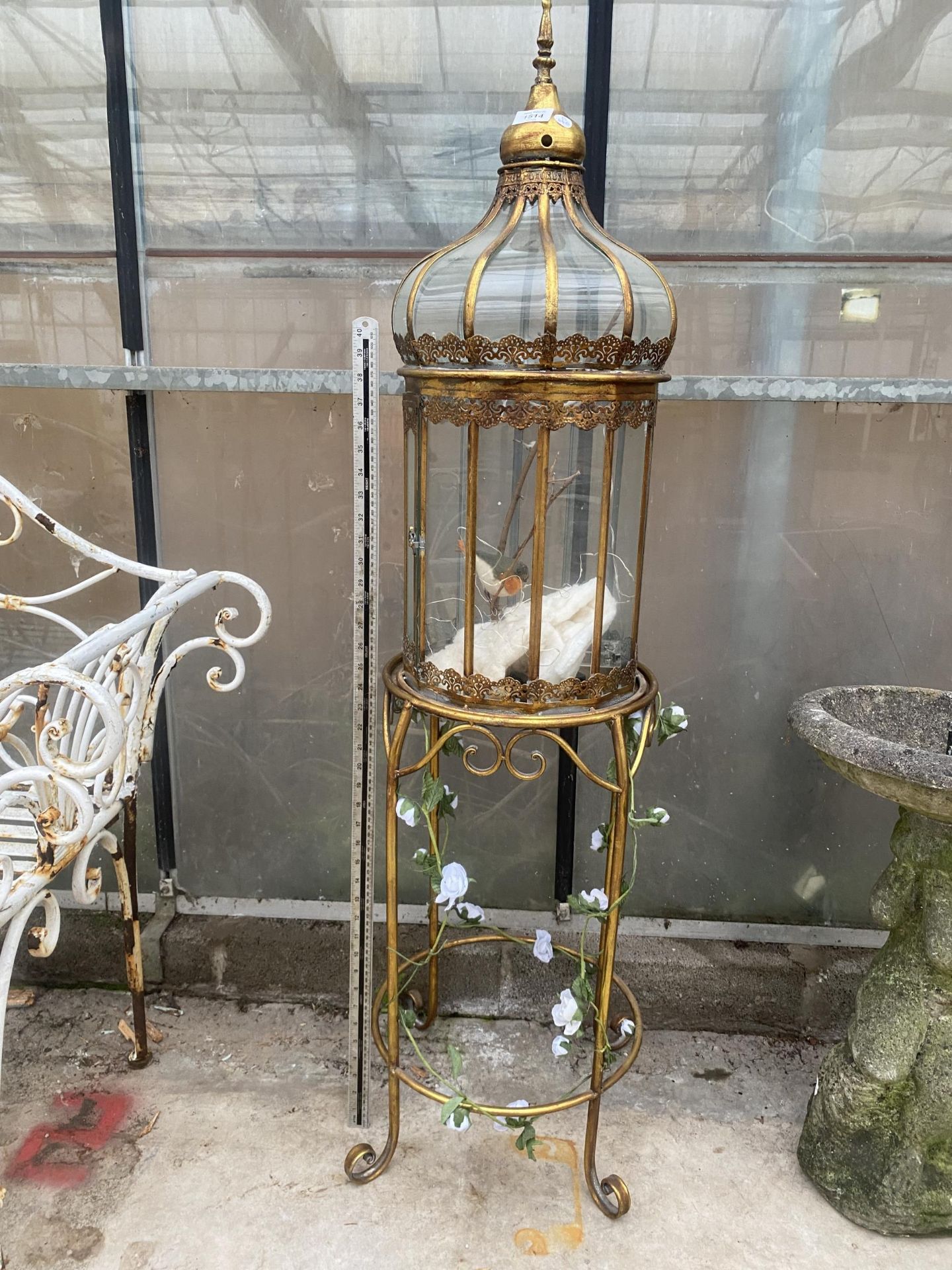 A DECORATIVE STEEL BRASS EFFECT GLASS DOME WITH STAND