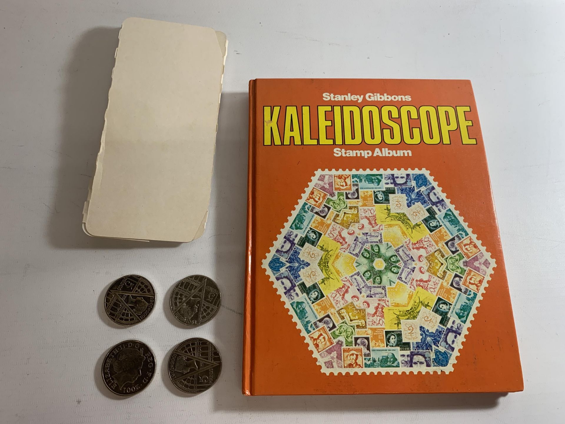 A STANLEY GIBBON KALEIDOSCOPE STAMP ALBUM CONTAINING STAMPS OF THE WORLD TO INCLUDE QATAR, DOMINICAN