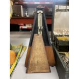 A VINTAGE SWISS WOODEN METRONOME