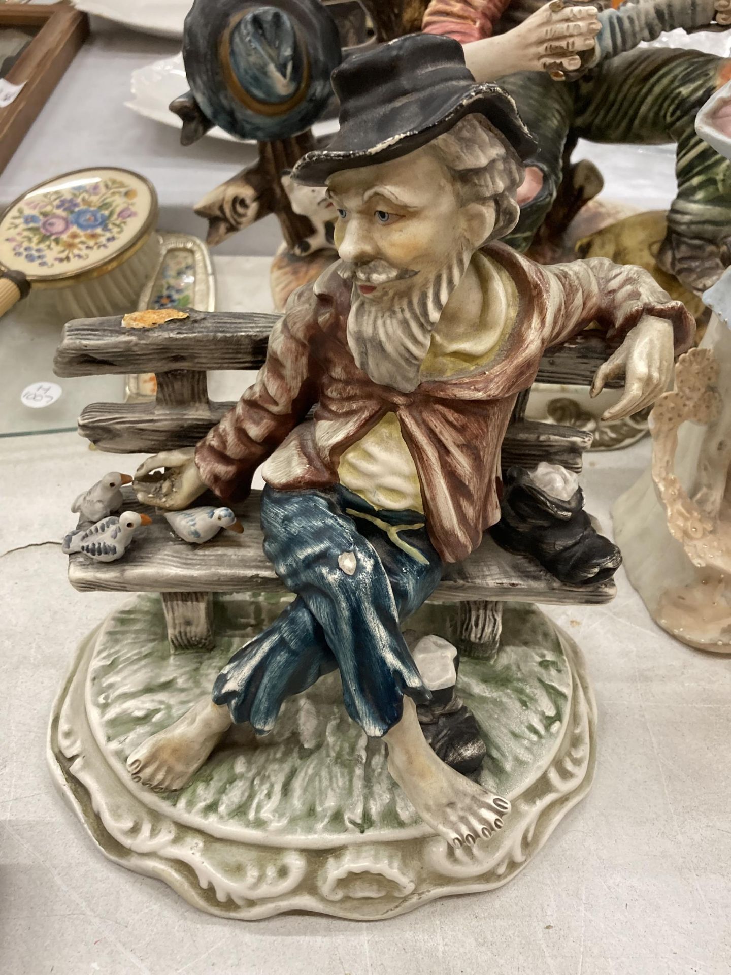 A CAPODIMONTE MODEL OF A MAN AND CAT PLAYING THE ACCORDIAN, CAPODIMONTE STYLE MAN ON A BENCH - A/F - Image 2 of 5