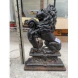 A VINTAGE CAST IRON LION DESIGN DOOR STOP