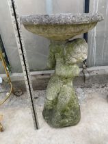 A DECORATIVE CONCRETE BIURD BATH WATER FEATURE WITH CHERUB PEDESTAL BASE