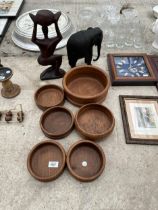 TWO TREEN CARVED FIGURES AND SIX ASSORTED TREEN BOWLS