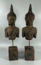 A PAIR OF DECORATIVE STONE BUDDHA HEAD AND TORSOS ON PLINTHS, HEIGHT 39 CM