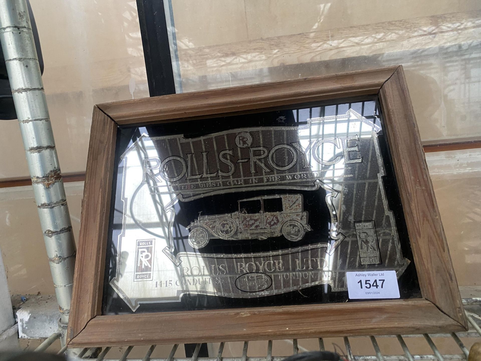 A VINTAGE WOODEN FRAMED 'ROLLS-ROYCE' ADVERTISING MIRROR