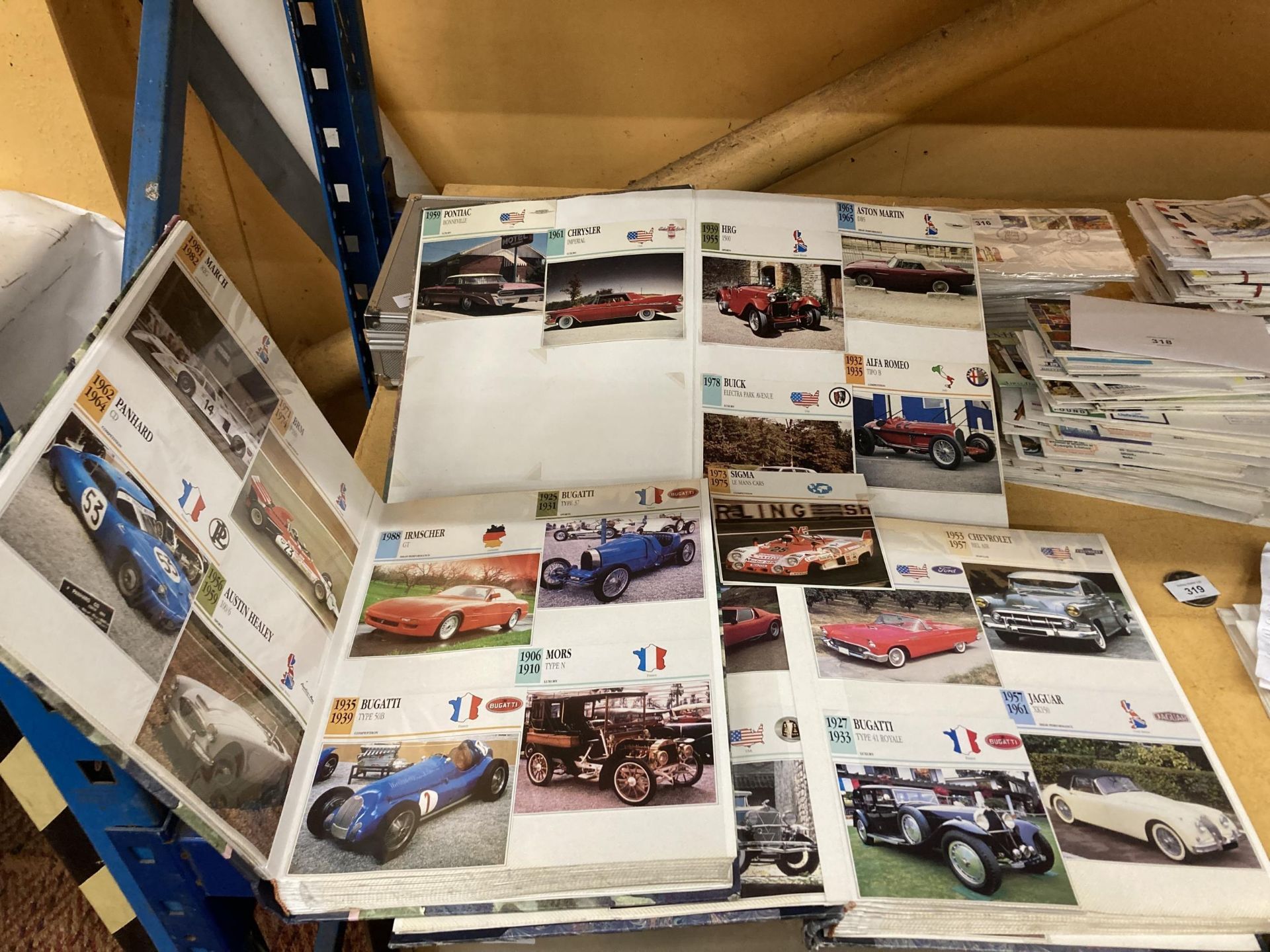 THREE ALBUMS CONTAINING APPROXIMATELY 645 VINTAGE CAR ELATED POSTCARDS IN THREE ALBUMS