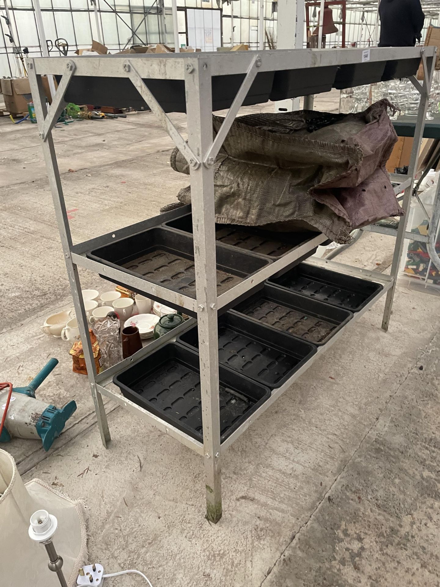 AN ALUMINIUM POTTING TABLE WITH PLASTIC TRAYS - Image 2 of 2