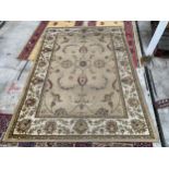 A BIEGE PATTERNED DUNELM RUG (160CM X 230CM)