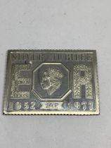 A QUEENS SILVER JUBILEE REPLICA OF A STAMP INGOT