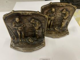 A PAIR OF VINTAGE BRONZE BOOK ENDS WITH RELIGIOUS DESIGN