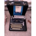 A RETRO ADLER GABRIELE 35 TYPE WRITER WITH CARRY CASE