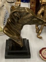 A BRONZE BUST OF A GREYHOUND HEAD ON A MARBLE BASE