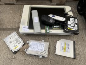 AN ASSORTMENT OF COMPUTER HARD DRIVES AND A MONITOR ETC