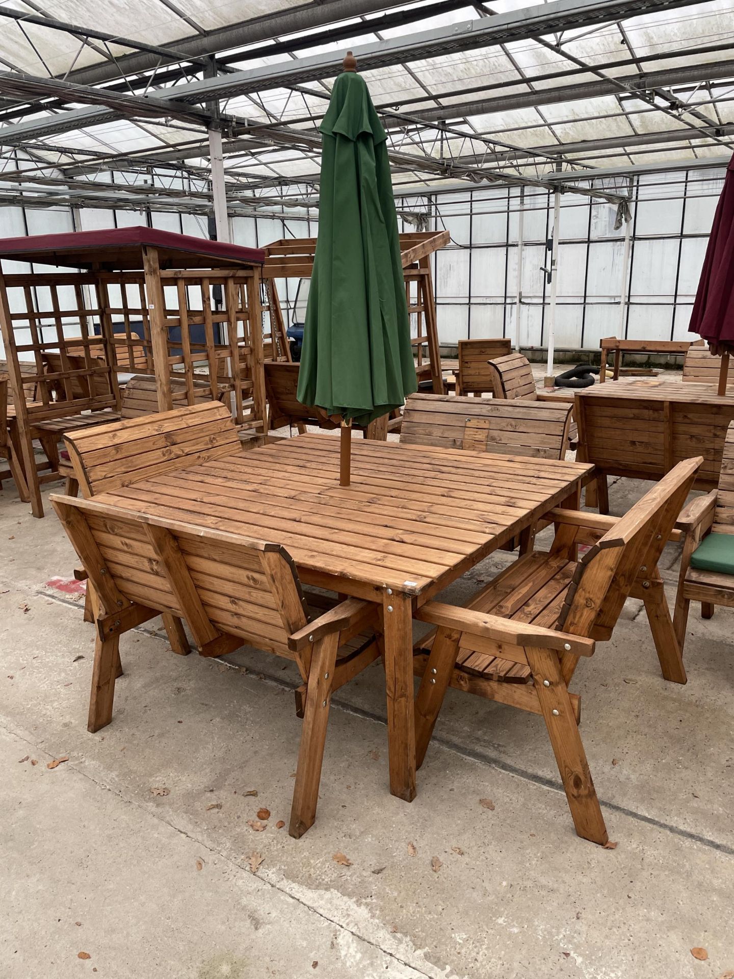 AN AS NEW EX DISPLAY CHARLES TAYLOR PATIO SET COMPRISING OF A LARGE SQUARE TABLE, FOUR TWO SEATER