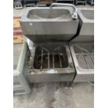 AN INDUSTRIAL STAINLESS STEEL TWO TIER SINK UNIT