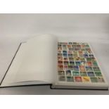 A STAMP ALBUM CONTAINING STAMPS FROM GERMANY AND DDR