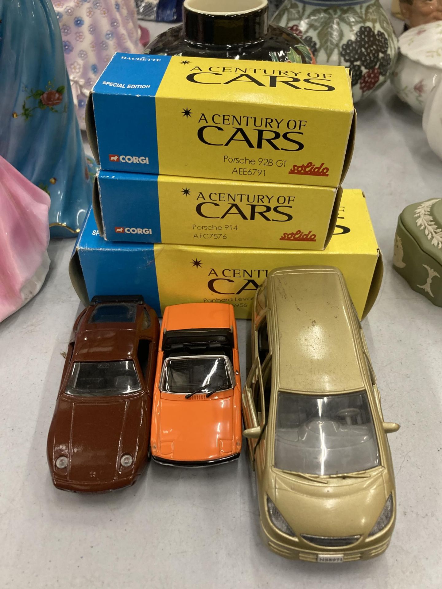 THREE BOXED CORGI 'A CENTURY OF CARS' TO INCLUDE A PORSCHE 928 GT, 914 AND A NISSAN PRAIRIE