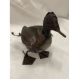 A METAL MODEL OF A DUCK